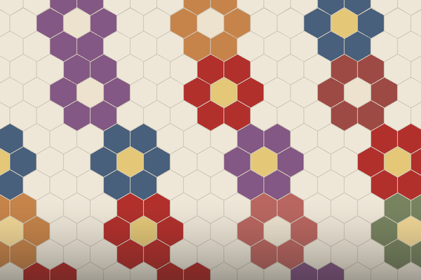 A field of Grandmother's Flower Garden rosettes in red, plum, blue, ochre and green hexagons on a cream path