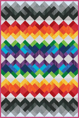 Rainbow Union quilt with rows of warm, cool and grey chevrons on a soft grey background