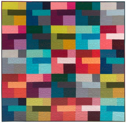 Colored Happy free quilt pattern made from a rainbow of solid cottons