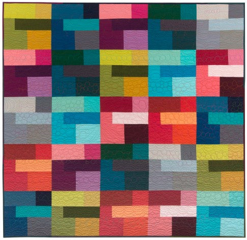 Colored Happy free quilt pattern made from a rainbow of solid cottons