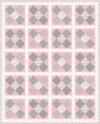 Hugs quilt with soft grey X blocks on a blush pink flannel background in the Pastel colourway