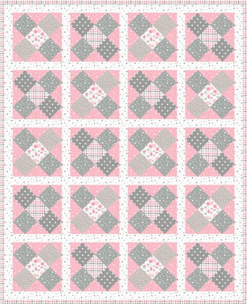 Hugs quilt with soft grey X blocks on a blush pink flannel background in the Pastel colourway
