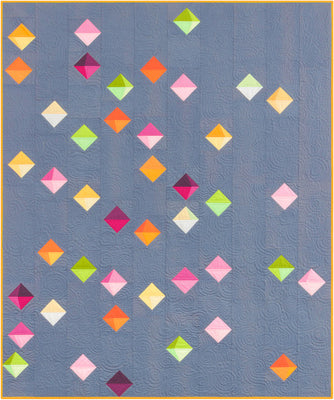 Floating Prisms free quilt pattern made from bright solid cottons