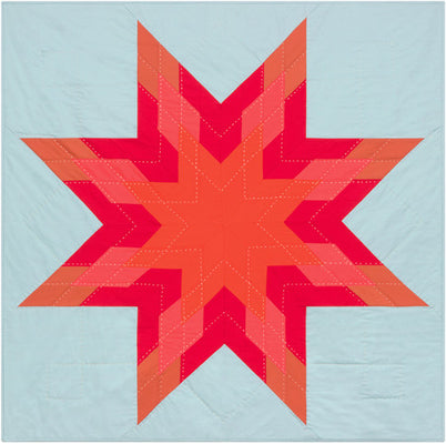 Red Star free quilt pattern, a bold star in warm reds and neutral solids