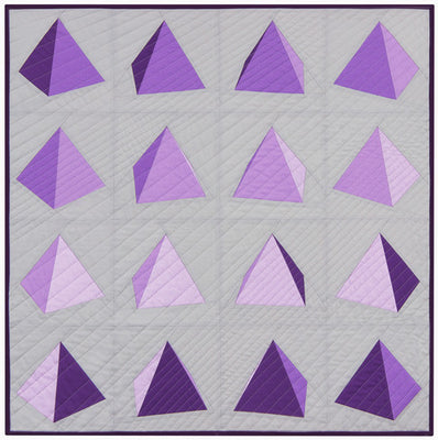 Spinning Pyramids quilt, sixteen paper pieced blocks of turning triangles in purple and pink on a grey background