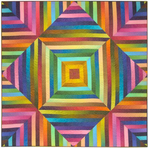 A shimmering colourful quilt made from many small pieces, finished at 70 inches square