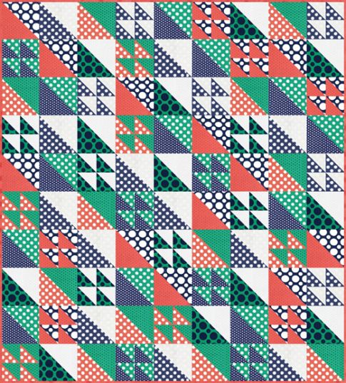 A playful spotted baby quilt made from a mix of leftover fabric pieces