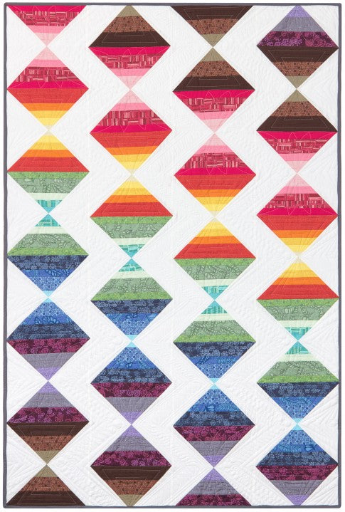 A modern strip quilt with colours flowing like the seasons, finished at 48 by 72 inches
