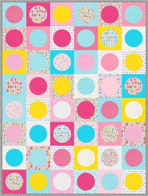 Seeing Spots quilt covered in colourful dots in soft pastel tones