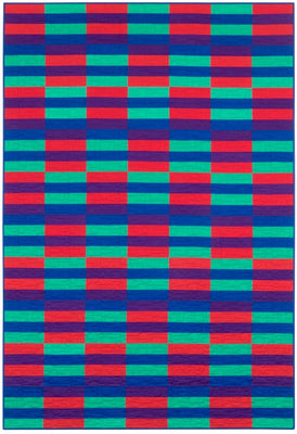A calm, modern strip quilt made from pre-cut 2.5 inch strips