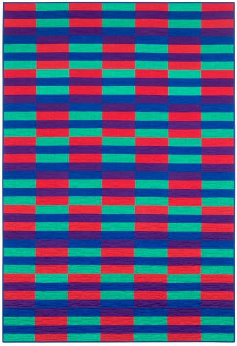 A calm, modern strip quilt made from pre-cut 2.5 inch strips