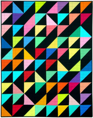 A bright half square triangle quilt made in solid colours