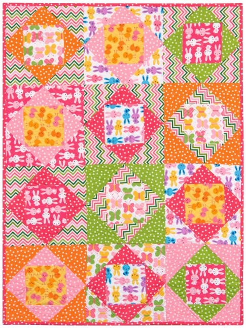 Soft flannel baby quilt in cheerful animal prints, made from economy blocks