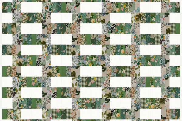 Blackthorn quilt in Morning Mist prints, white blocks and bands of print staggered like brickwork across nineteen rows