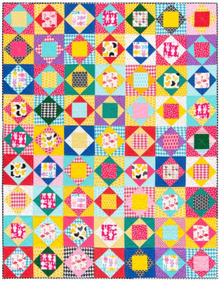 Playful Animals free quilt pattern made with bright novelty prints and solids