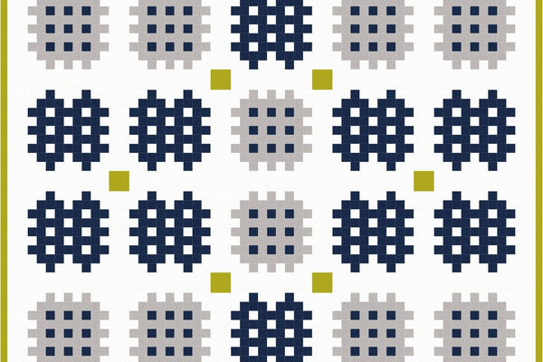 Kilim quilt in white, gray, navy and olive Kona solids, thirty notched lattice blocks set with white sashing and small olive cornerstones