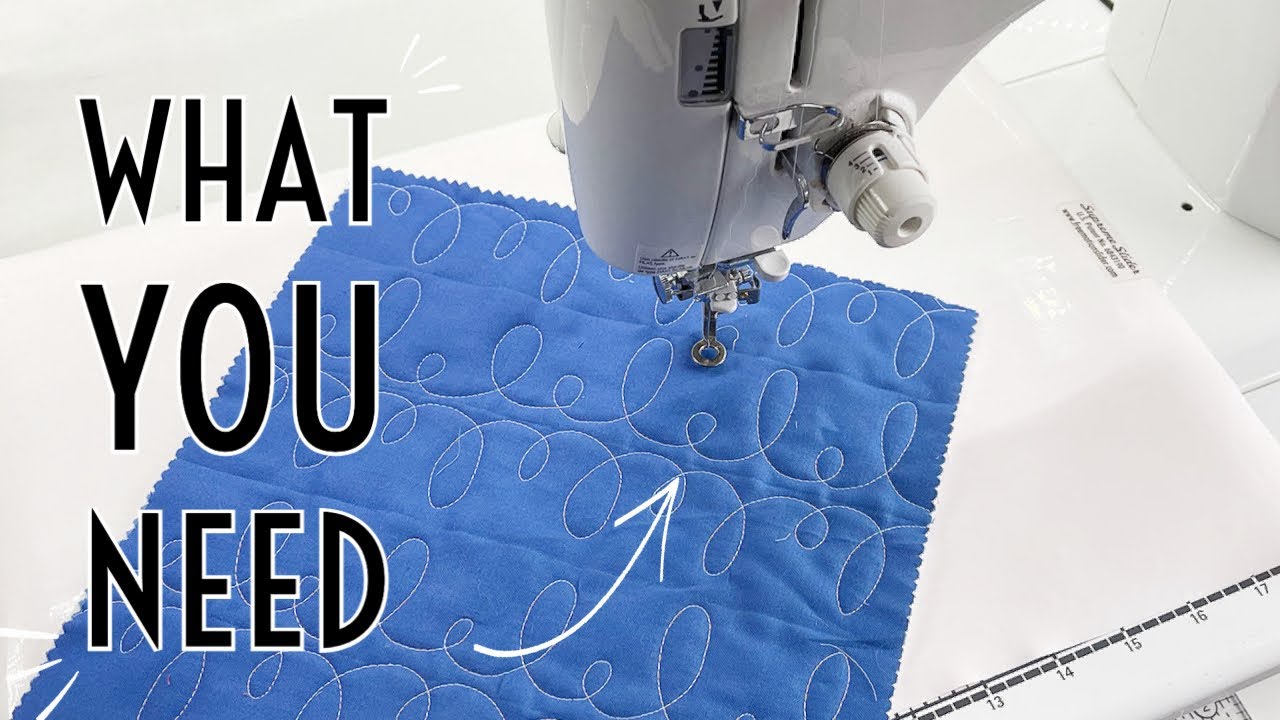 Quilt layers rolled onto lengths of timber and unrolled a band at a time across a table for basting