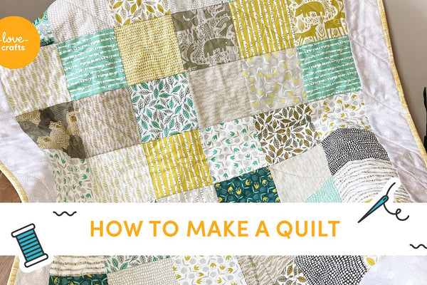 A finished one patch beginner quilt made from five inch squares with a border and straight binding