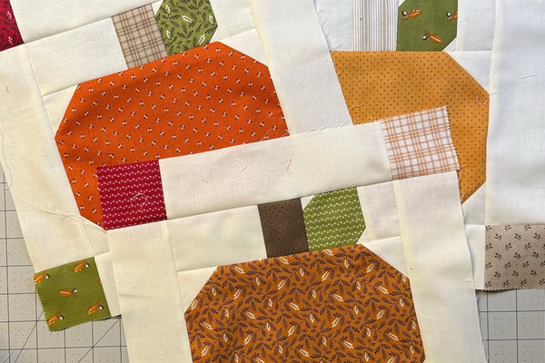 A pumpkin quilt block designed to fit a space in a quilt