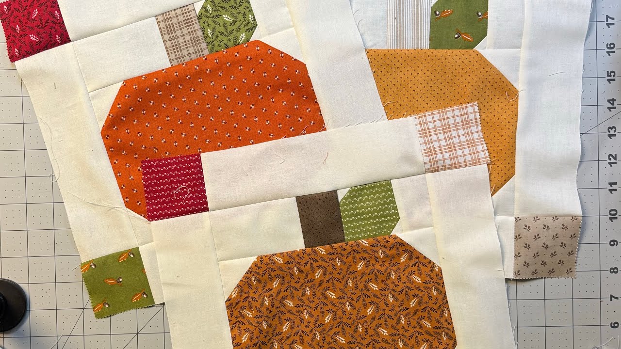 A pumpkin quilt block designed to fit a space in a quilt