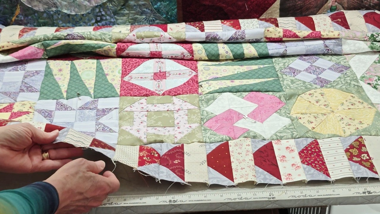 Evaluating a quilt top for square, wavy borders and bias stretch before quilting