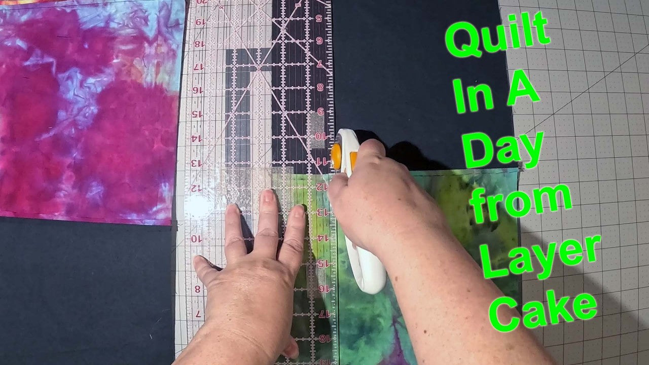 Modern quilt made from 20 layer cake squares in a day