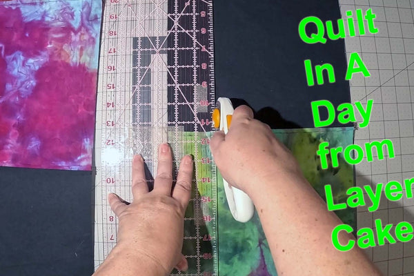 Modern quilt made from 20 layer cake squares in a day