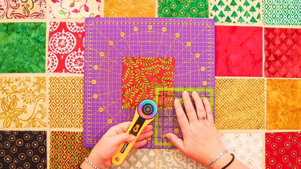A fast charm square quilt made from 5 inch squares for Christmas in July