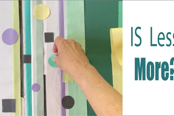 an improv layout of strips in soft greens and purples with white between them, gray strips and squares and a few circles placed on top