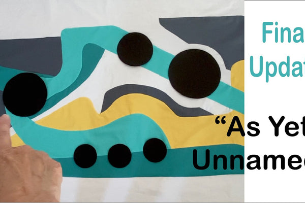 A fabric circle prepared for applique over a card template