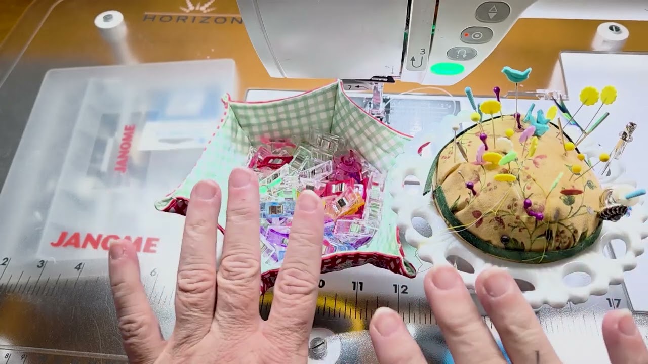 Essential quilting tools beside a sewing machine