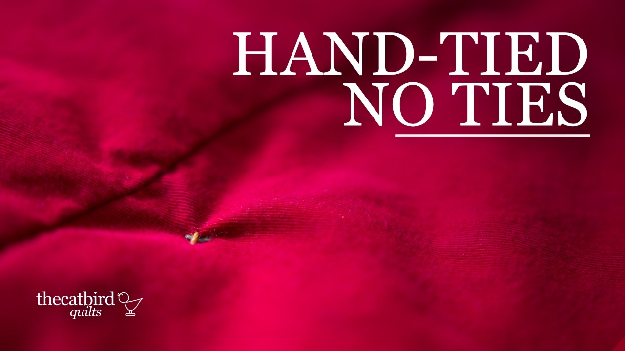 Tying a quilt with the knot hidden inside for a clean top and full loft
