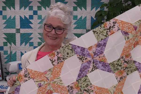 The Garden Gate pre-cut quilt kit finished at 60 by 72 inches