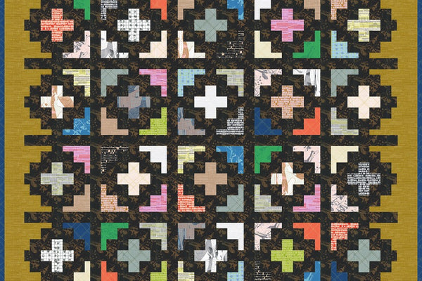 Monte quilt, a field of plus shapes in assorted prints on a black ground with a gold border notched by cross shapes
