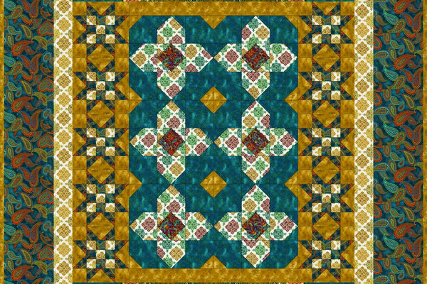 The Fiori di Trieste quilt in teal and gold, a medallion with a printed panel top and bottom and a column of sawtooth stars down each side