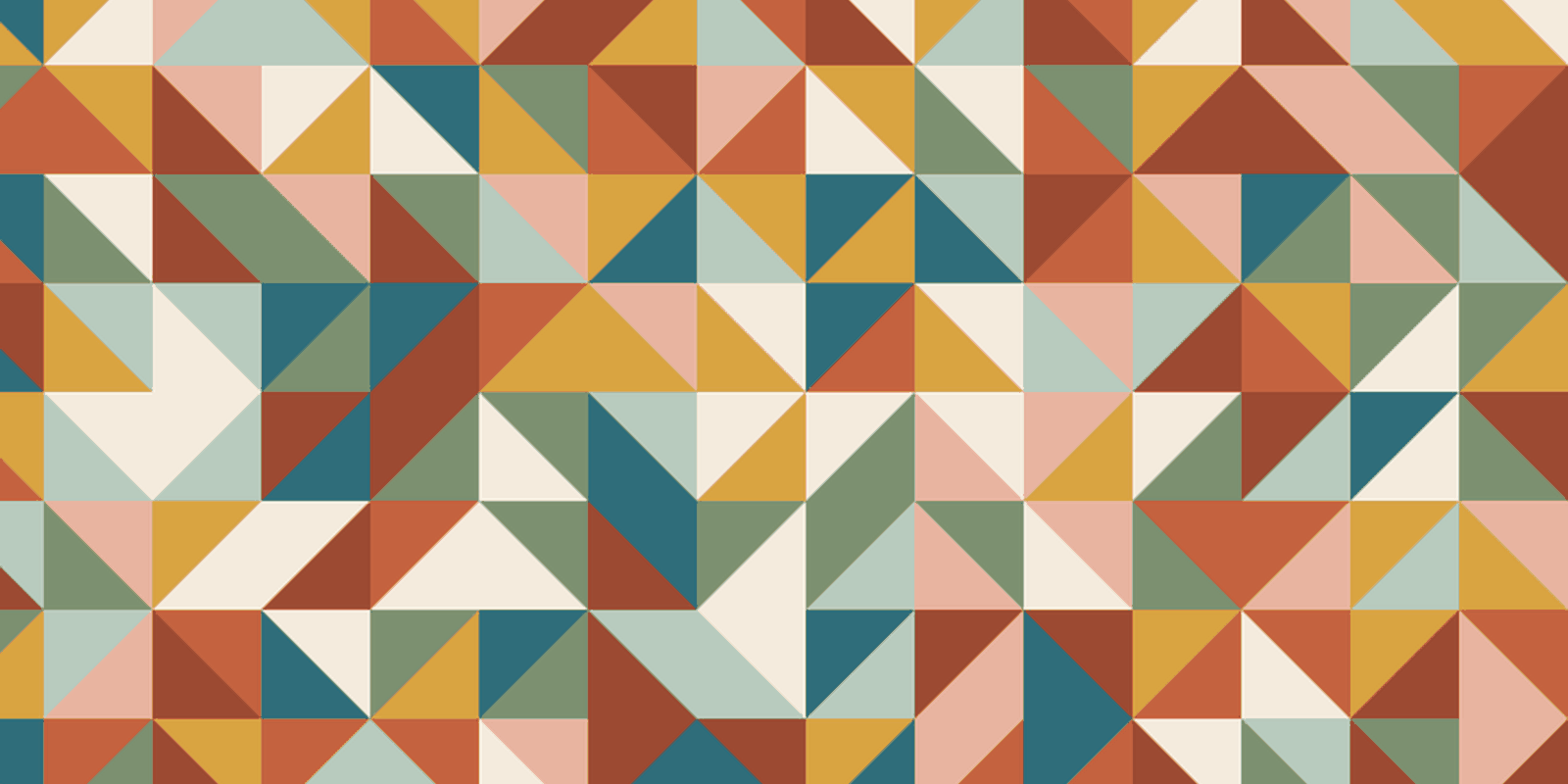 Quilt top of half square triangles in terracotta, mustard, sage, teal and cream