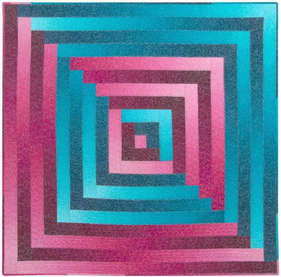 A spiral strip quilt wound outward from a single centre square, finished at 42.5 inches square