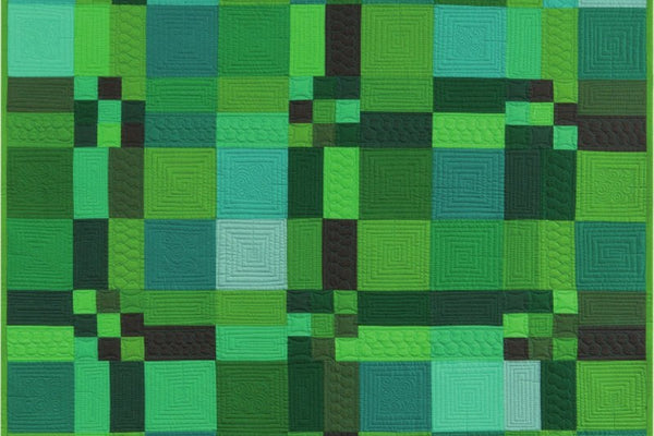 Wonderous Woods quilt in twelve green Kona solids, twelve large blocks of plain squares, two rectangle bars and small nine patches