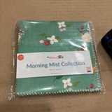 Morning Mist 5 inch charm squares laid out, part of the 480 piece four collection sampler bundle