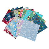 Blossom Breeze print swatches with navy grounds carrying poppies, roses and daisies