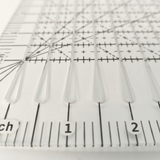 10 inch by 8 inch slotted quilting ruler, clear acrylic with measured slots for cutting 2.5 inch strips - The Fabric Hut