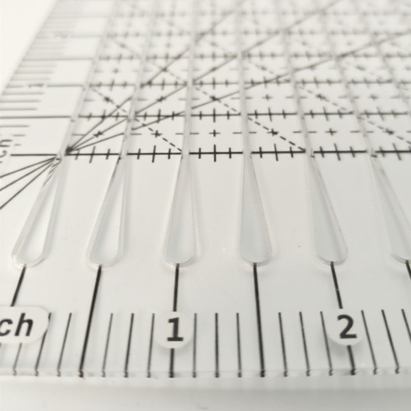 10 inch by 8 inch slotted quilting ruler, clear acrylic with measured slots for cutting 2.5 inch strips - The Fabric Hut