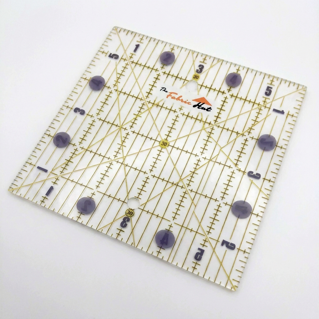 The Fabric Hut 6 inch clear acrylic square quilting ruler with inch markings and 30, 45 and 80 degree angle lines, included free with this 480 piece charm square bundle
