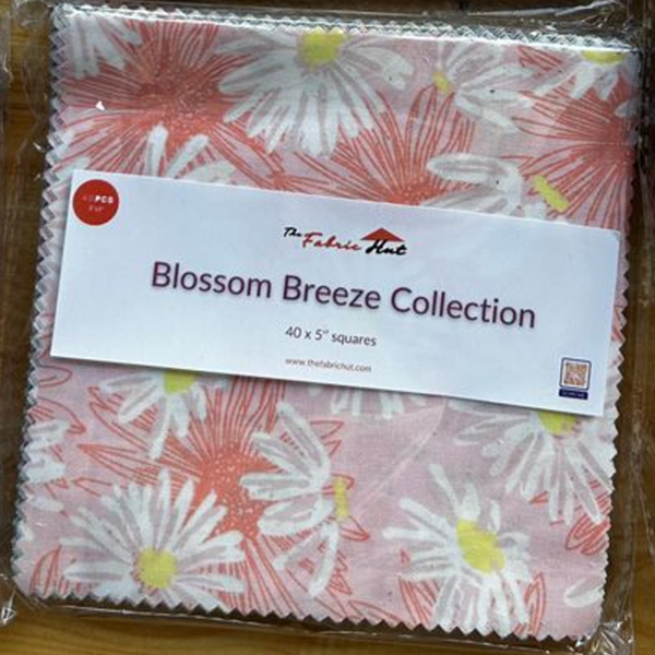 Blossom Breeze charm squares arranged to show the coral, navy, aqua and cream colour range
