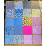 Patchwork Carnival Collection - 20 of the 40 cotton fabric prints laid out flat, photo 1 of 2 - The Fabric Hut
