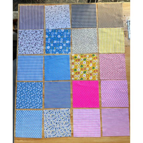 Patchwork Carnival Collection - 20 of the 40 cotton fabric prints laid out flat, photo 1 of 2 - The Fabric Hut