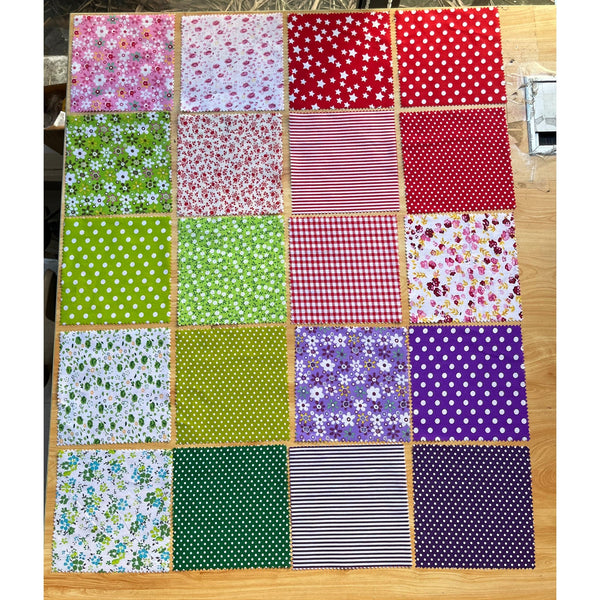 Patchwork Carnival Collection - 20 of the 40 cotton fabric prints laid out flat, photo 2 of 2 - The Fabric Hut