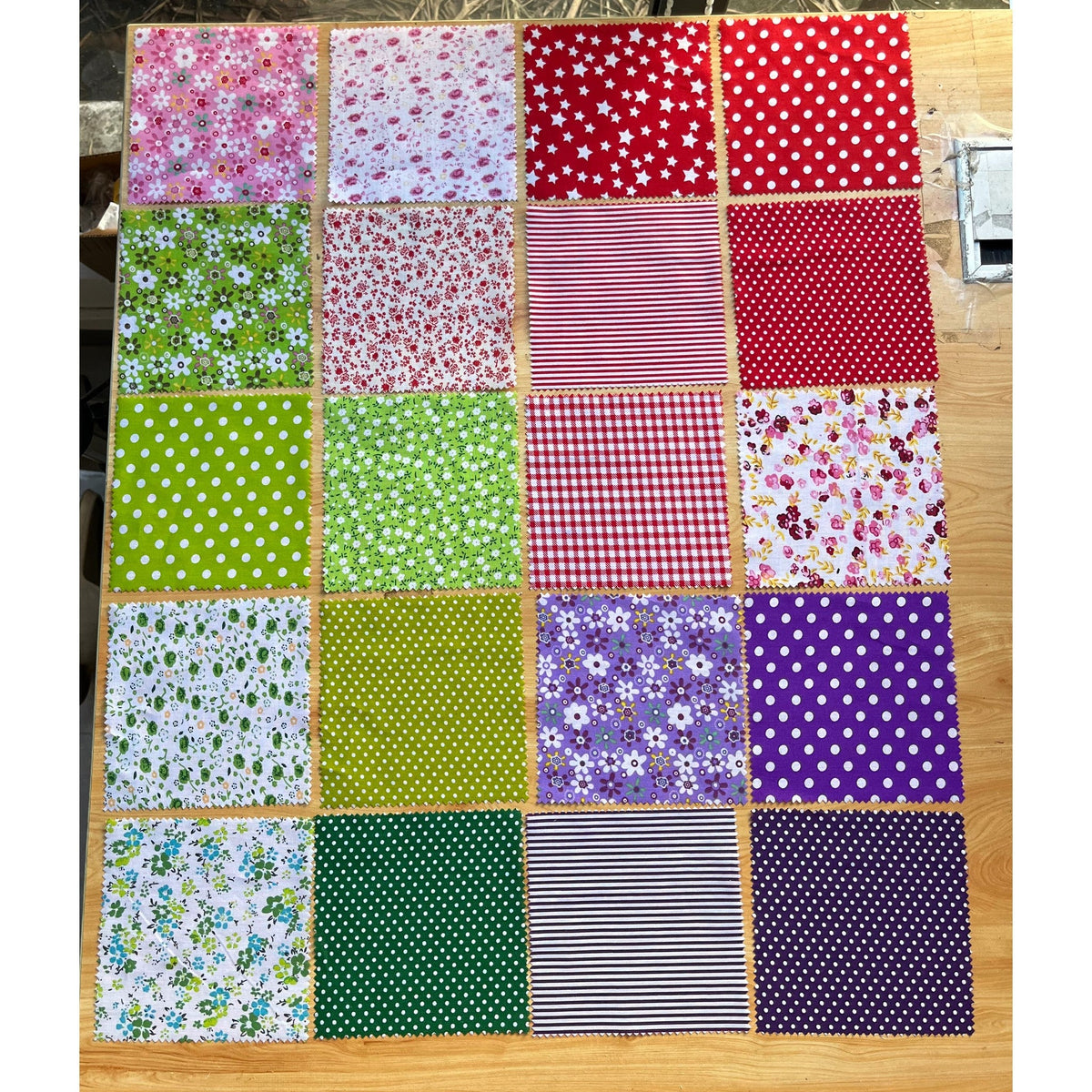 Patchwork Carnival Collection - 20 of the 40 cotton fabric prints laid out flat, photo 2 of 2 - The Fabric Hut