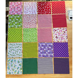 Patchwork Carnival Collection - 20 of the 40 cotton fabric prints laid out flat, photo 2 of 2 - The Fabric Hut